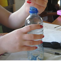 fill bottle with sand